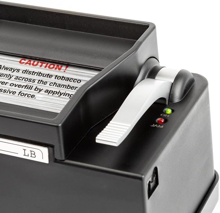 Close-up of Powermatic 2 Plus electric cigarette injector lever and jam indicator lights