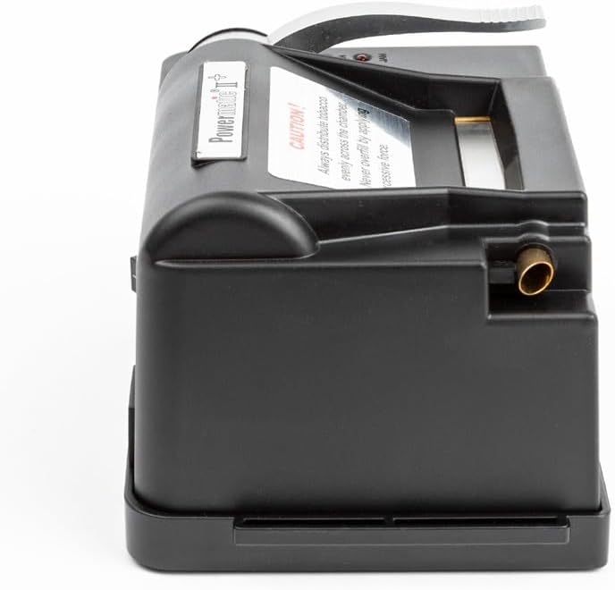 Side profile view of Powermatic 2 Plus electric cigarette injector machine showing injection nozzle and lever mechanism